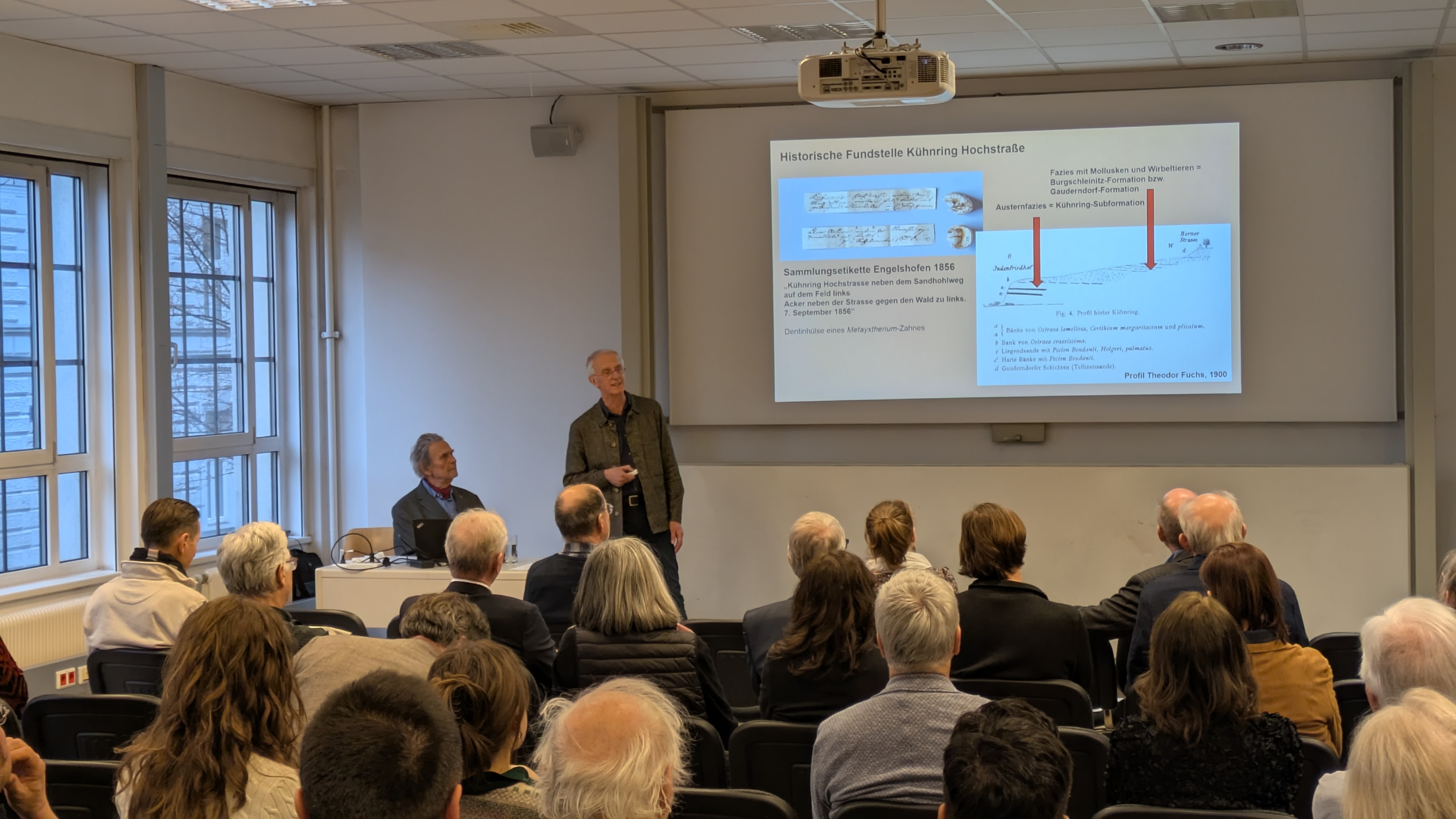 Several people in a lecture room